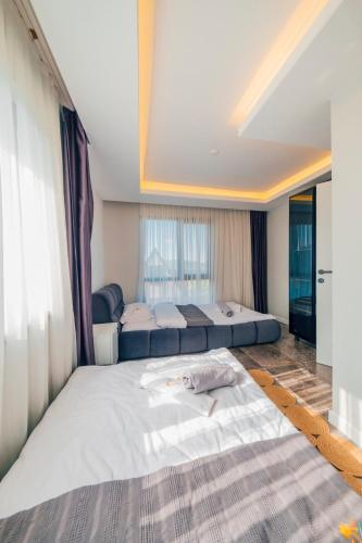 a large bedroom with two beds and a window at tetova in Sapanca