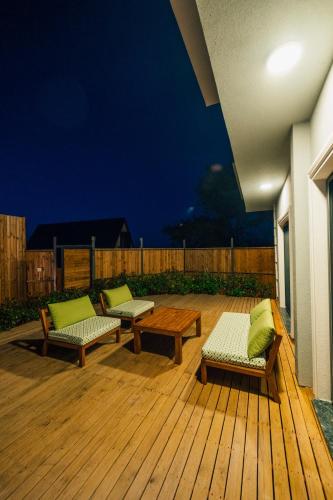 a patio with two benches and a table on a deck at tetova in Sapanca