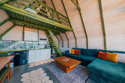 a living room with a blue couch and a table at tetova in Sapanca