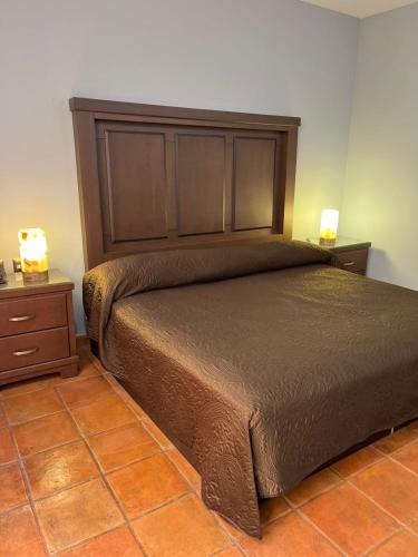 Postel nebo postele na pokoji v ubytování Hotel Portal de Reyes