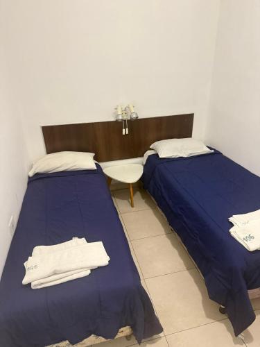 Ένα ή περισσότερα κρεβάτια σε δωμάτιο στο Hotel Nuevo Premier