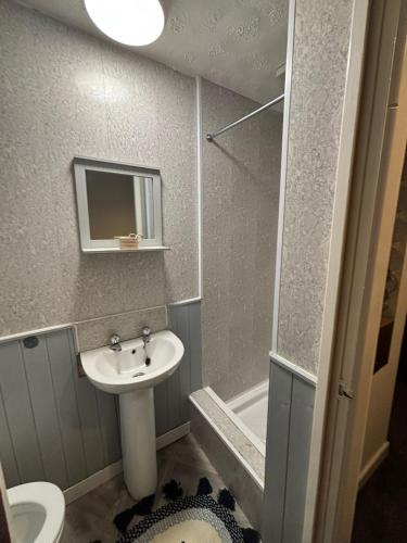 a bathroom with a sink and a toilet and a shower at Affordable Golden Mile Hotel In Blackpool Close To The Beach And Blackpool City Centre With Free Street Parking Subject To Availabilty in Blackpool