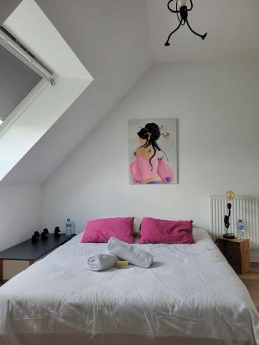 Ένα ή περισσότερα κρεβάτια σε δωμάτιο στο chambre d'hôte