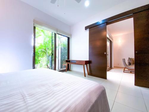 Postel nebo postele na pokoji v ubytování Untamed Luxury Jungle 2BR Home in Bahia Principe