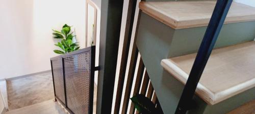 a staircase with a metal railing and a stair case at Dimora Muneghette 181 ApartSuite House Chioggia in Chioggia