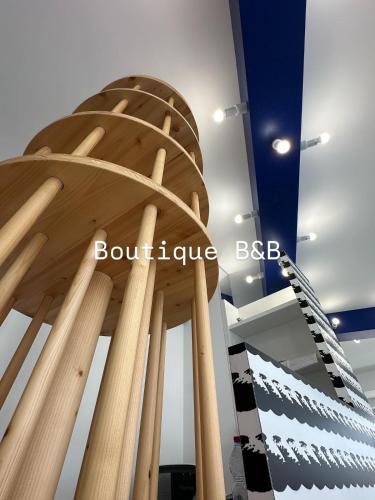 a exhibit of a building with a spiral staircase at B&B Margherita Lido Marini in Lido Marini