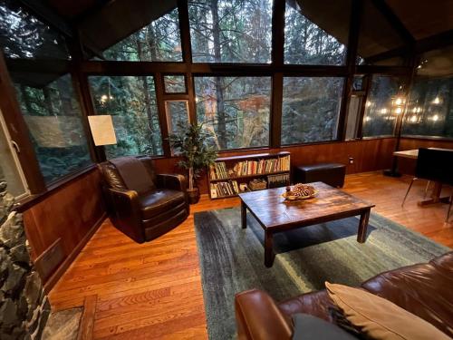 a living room with a couch and a coffee table at The Treehouse in North Bend