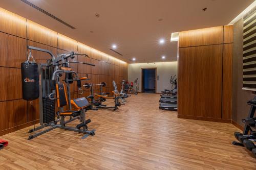 a gym with several exercise equipment in a room at فندق الترحيب Atarheeb Hotel in Tabuk