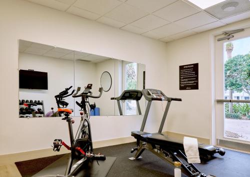 a gym with two exercise bikes in a room at voco Kissimmee Orlando by IHG in Orlando