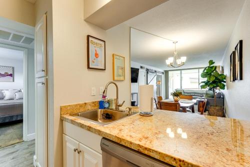 a kitchen with a sink and a living room at Walkable Old Town Scottsdale Condo Pool and Hot Tub in Scottsdale