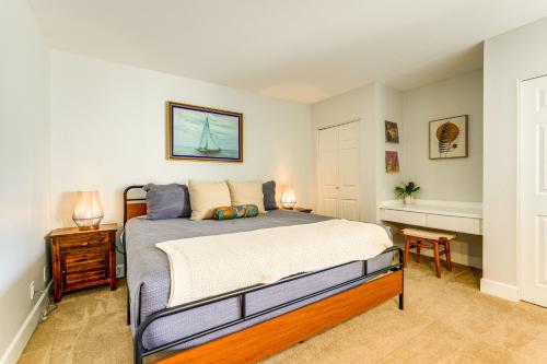 a bedroom with a large bed and a desk at Walkable Old Town Scottsdale Condo Pool and Hot Tub in Scottsdale