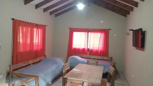 Postel nebo postele na pokoji v ubytování Cabañas Kangarú