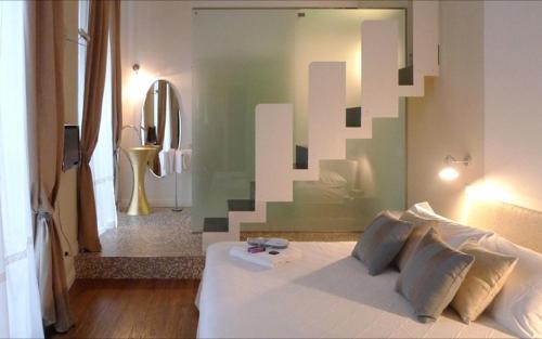 Ένα ή περισσότερα κρεβάτια σε δωμάτιο στο B&B Casa Fenoglio