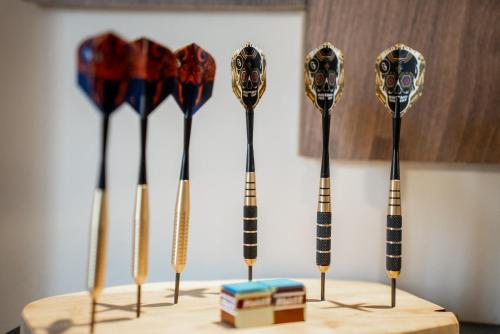 a group of umbrellas on a wooden table at Play & Chill - Loft Cosy in Hyères