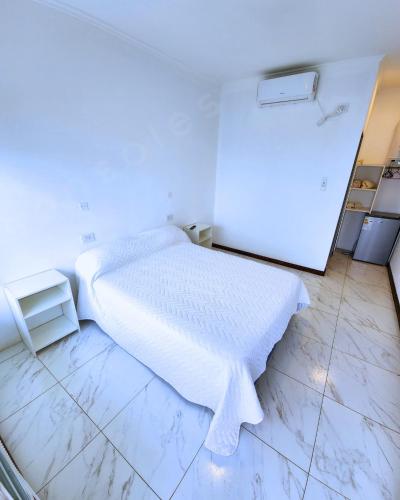 Ένα ή περισσότερα κρεβάτια σε δωμάτιο στο sonsoles hotel