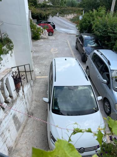 a white car parked in a parking lot at Green Villa in Bar, Susanj