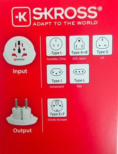 une machine rouge avec des icônes sur le devant d'une porte dans l'établissement Appartement élégant proche Paris, à Clichy