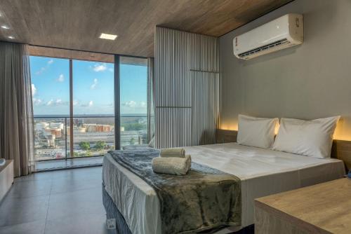 Ένα ή περισσότερα κρεβάτια σε δωμάτιο στο Edifício New Time Apto 1215-Mandi Hospitalidade