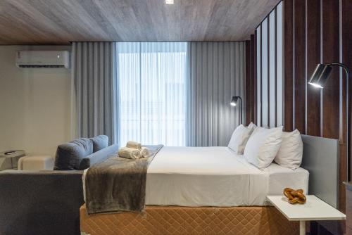 Giường trong phòng chung tại Edifício New Time Apt 1405-Mandi Hospitalidade