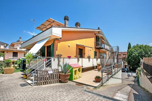 a house with a staircase in front of it at Chianti Wine Site Apt Private Balcony - Happy Rentals in Montespertoli