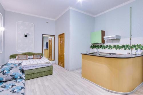 a room with a bed and a sink in it at Апартаменты на Дерибасовской in Odesa