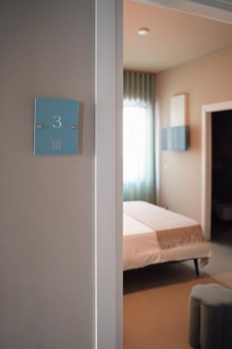 Una cama o camas en una habitación de Numero 5 B&B