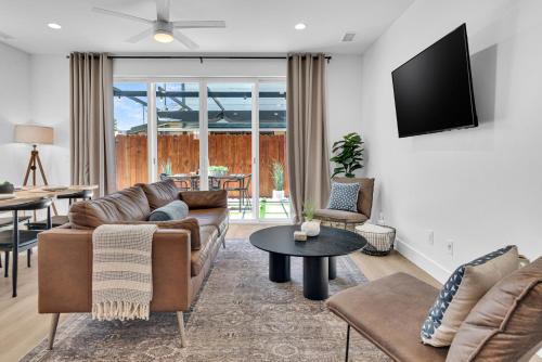 a living room with a couch and a table at The Park Street Hideaway in Downtown Paso in Paso Robles