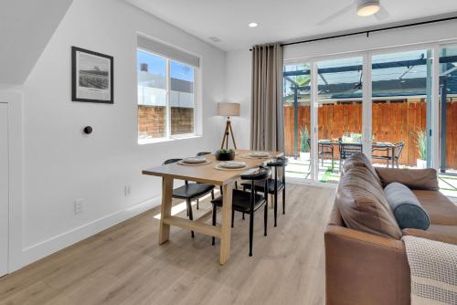 a living room with a table and a couch at The Park Street Hideaway in Downtown Paso in Paso Robles