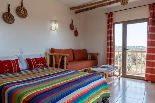 Ένα ή περισσότερα κρεβάτια σε δωμάτιο στο Kaouki Zen Lodge