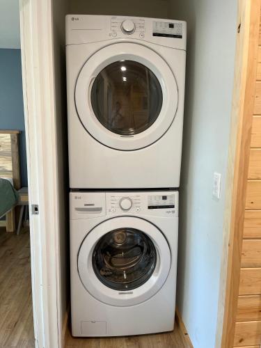 a washer and dryer stacked on top of each other at Kenai Adventure Cabins in Soldotna