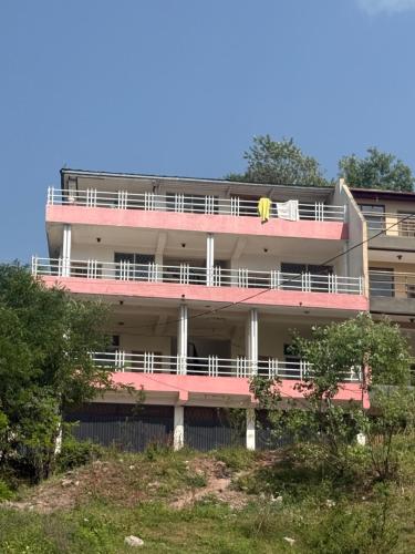an apartment building with a banana on the balcony at Bhurban heights in Murree