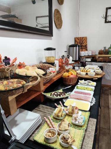 a buffet line with many different types of food at Hostal & Domos Bello Horizonte in Villarrica