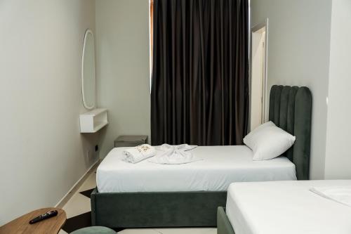 Postel nebo postele na pokoji v ubytování OLI Hotel