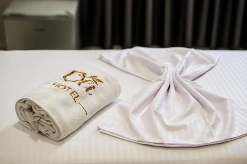 Postel nebo postele na pokoji v ubytování OLI Hotel