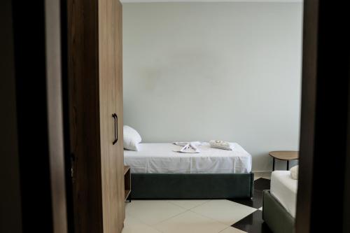Postel nebo postele na pokoji v ubytování OLI Hotel