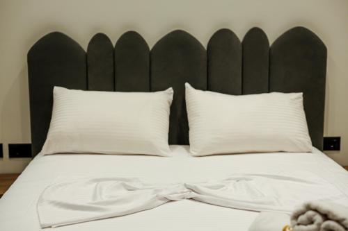 Postel nebo postele na pokoji v ubytování OLI Hotel
