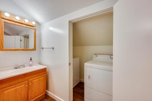 a bathroom with a sink and a washing machine at half Mi to Campton Mtn Resort-Style Condo in Campton