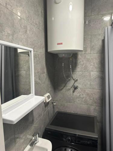 a small bathroom with a sink and a mirror at Perfect place 4 Djenovici in Đenovići