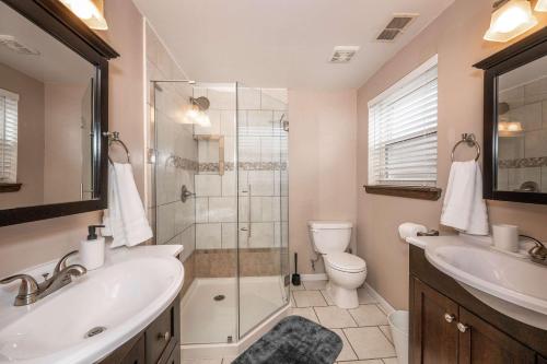 a bathroom with a sink toilet and a shower at Mason Marvel Luxe Stay with Pool and Hot Tub in Mason