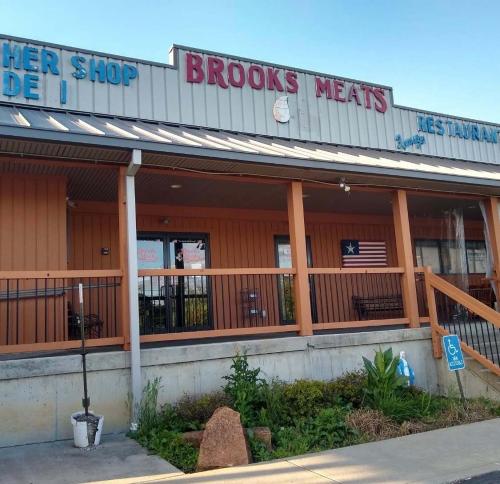 a storefront of a grocery store with a sign that reads floods meats at The Gem Vacation Rental in Walton
