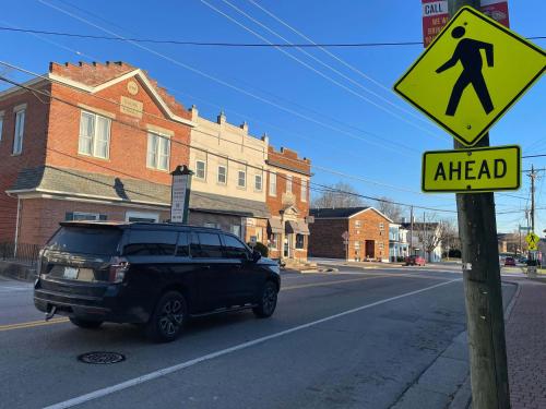 a van parked on a street with a ahead sign at The Gem Vacation Rental in Walton