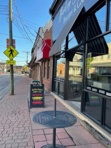 a street with a bench in front of a store at The Gem Vacation Rental in Walton