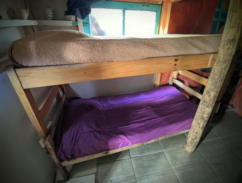 a couple of bunk beds in a room at Tiny House in Cabo Polonio