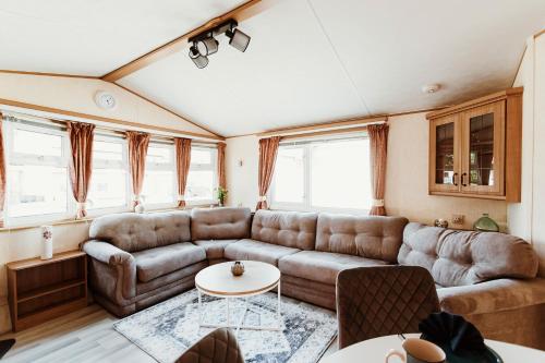 a living room with a couch and a table at Villa Hexengericht in Thale