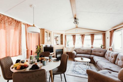 a living room with a couch and a table at Villa Hexengericht in Thale