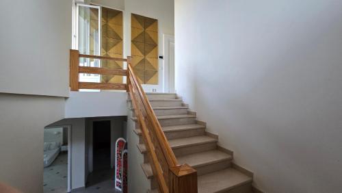 a staircase in a house with a skateboard at Top privacy Eco Villa of 2023 @ TEG hill Tirana in Tirana