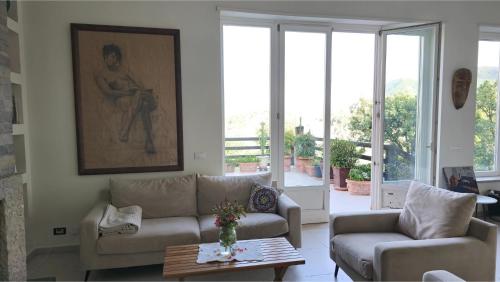 a living room with two couches and a table at Top privacy Eco Villa of 2023 @ TEG hill Tirana in Tirana