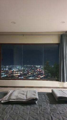 Un ou plusieurs lits dans un hébergement de l'établissement Mirador B&B