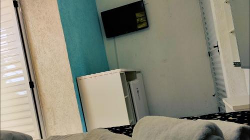 Μια τηλεόραση ή/και κέντρο ψυχαγωγίας στο Casa DaLua Suítes