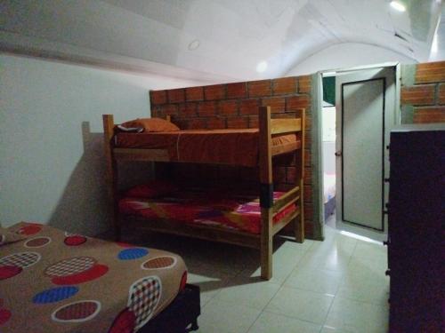 Katil atau katil-katil dalam bilik di Casa de relajación low cost
